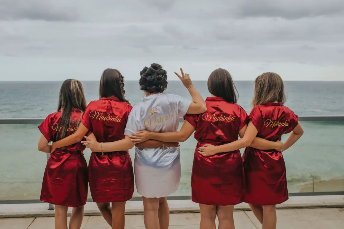 brides and bridesmaid looking at the back - JGA