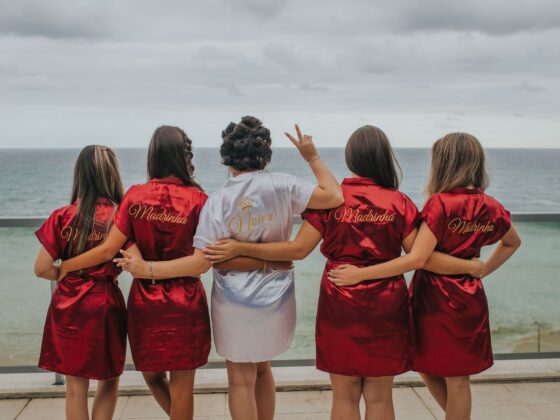 brides and bridesmaid looking at the back - JGA