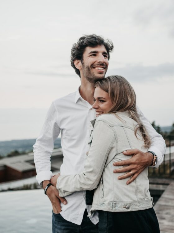 man and woman hugging each other